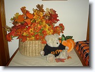 Halloween2008_006 * A basket of Autumn leaves and a little Teddy bear dressed in his Halloween Boo sweater sit beside the front door. * A basket of Autumn leaves and a little Teddy bear dressed in his Halloween Boo sweater sit beside the front door. * 1280 x 960 * (554KB)