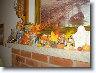 Halloween2008_011 * Another view of the fireplace mantle, showing silk autumn leaves and assorted little pumpkins and witches. * Another view of the fireplace mantle, showing silk autumn leaves and assorted little pumpkins and witches. * 1280 x 960 * (559KB)
