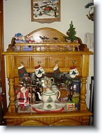 DSC02069 * Another small hutch in the kitchen holds a Coca Cola Santa, our favorite Christmas tea pot and is topped with Santa and his sleigh-team, led by Rudolph. * Another small hutch in the kitchen holds a Coca Cola Santa, our favorite Christmas tea pot and is topped with Santa and his sleigh-team, led by Rudolph. * 960 x 1280 * (341KB)