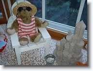 DSC02450 * This is Winslow wearing his swimsuit and boater straw hat.  He is relaxing in his Adirondack chair beside the sand castle. * This is Winslow wearing his swimsuit and boater straw hat.  He is relaxing in his Adirondack chair beside the sand castle. * 1280 x 960 * (574KB)