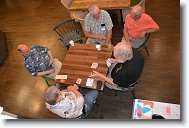 20250809_220405 * What is a Lange Reunion without a game of 500?  Playing the game are (starting at the left and proceeding clockwise): Brannian, Jer Olsem, (Kevin M. Greiner watching), Hugmo and Animal. * 4496 x 3000 * (7.92MB)